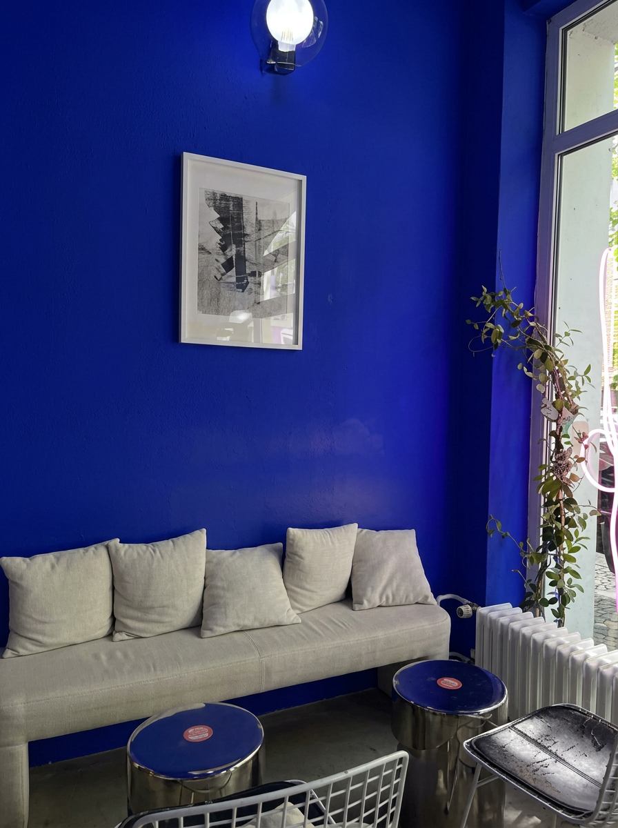 Ultramarine blue interior with a cream-colored bench